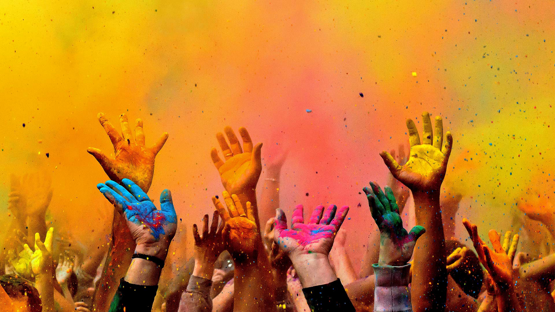 Colorful Holi festival celebration with people throwing colors